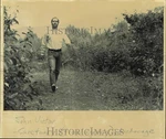 1988 Press Photo John Victor Walks Path Through Flowers In Anchorage Unspecified. Price: $24.99.