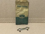John Deere Original Equipment # AM668T - Sub M254T Lock Capscrew 1010 Tractor New. Price: $15.29.