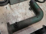 John Deere Late Carburetor Elbow B2371R Sn 201000 258520 Used. Price: $12.50.